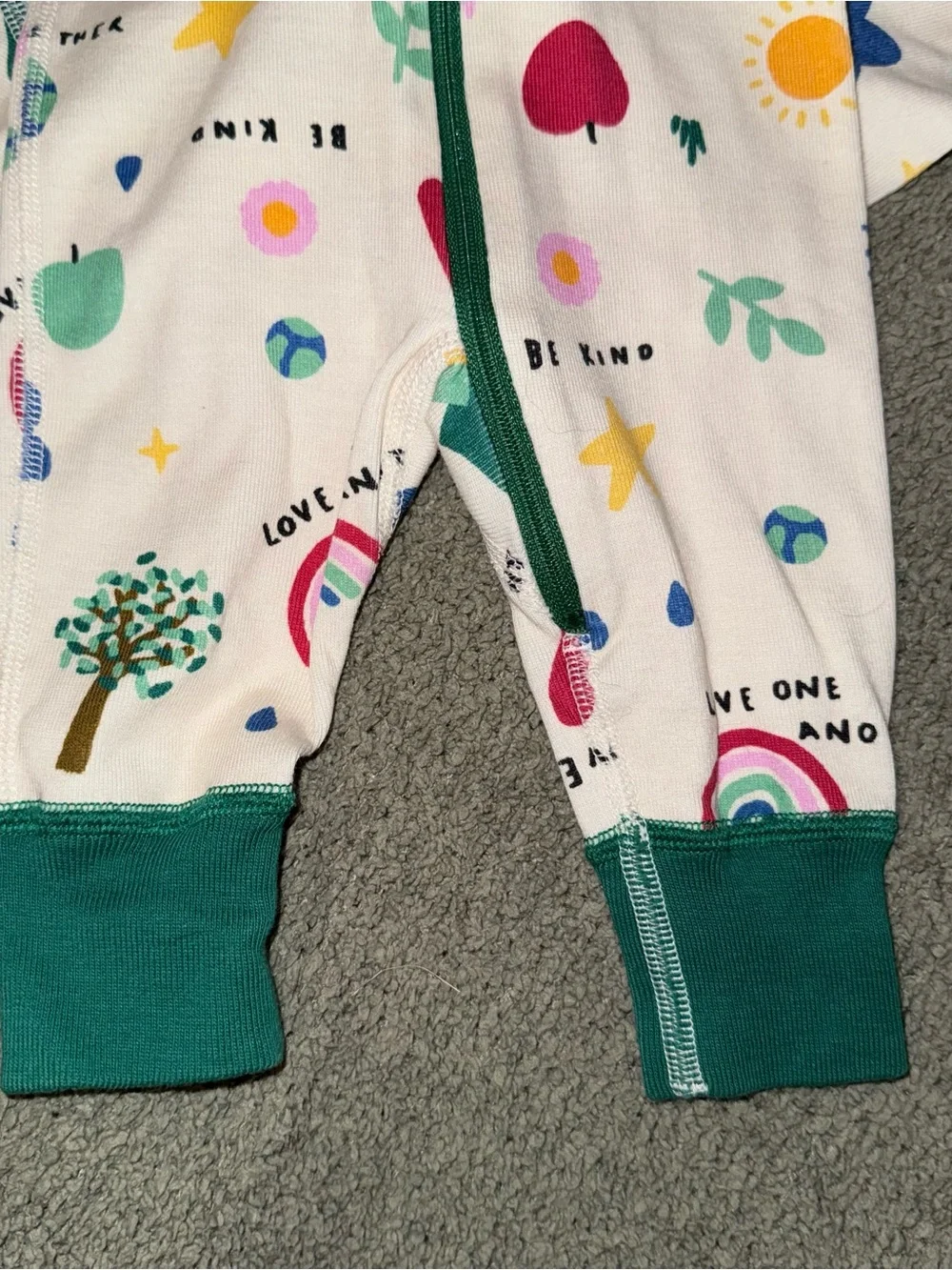 Hanna Andersson Cream Romper with Green Trim and Multicolor Prints
